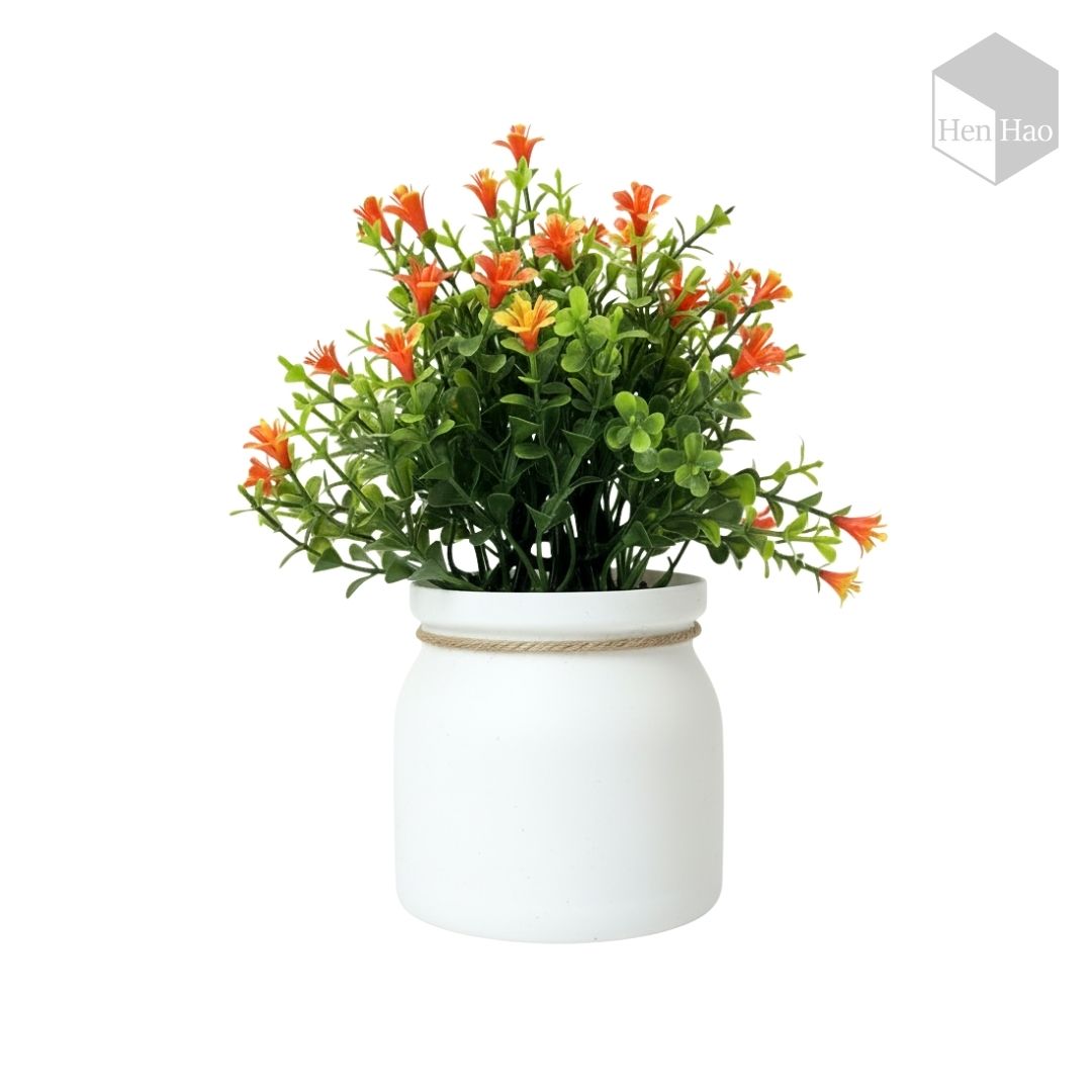 Planta decorativa artificial con flores