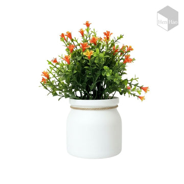 Planta decorativa artificial con flores