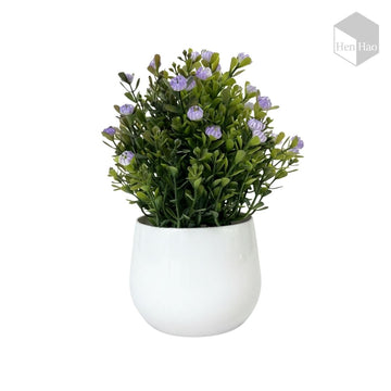 Planta decorativa artificial con flores